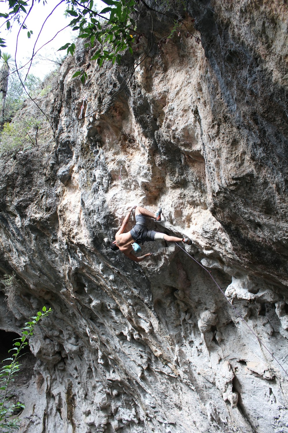 man climbing on mountain during daytime