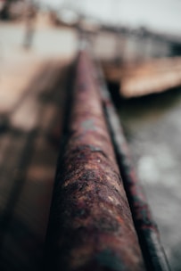 Close-up of a craftsman welding and shaping a metal handrail