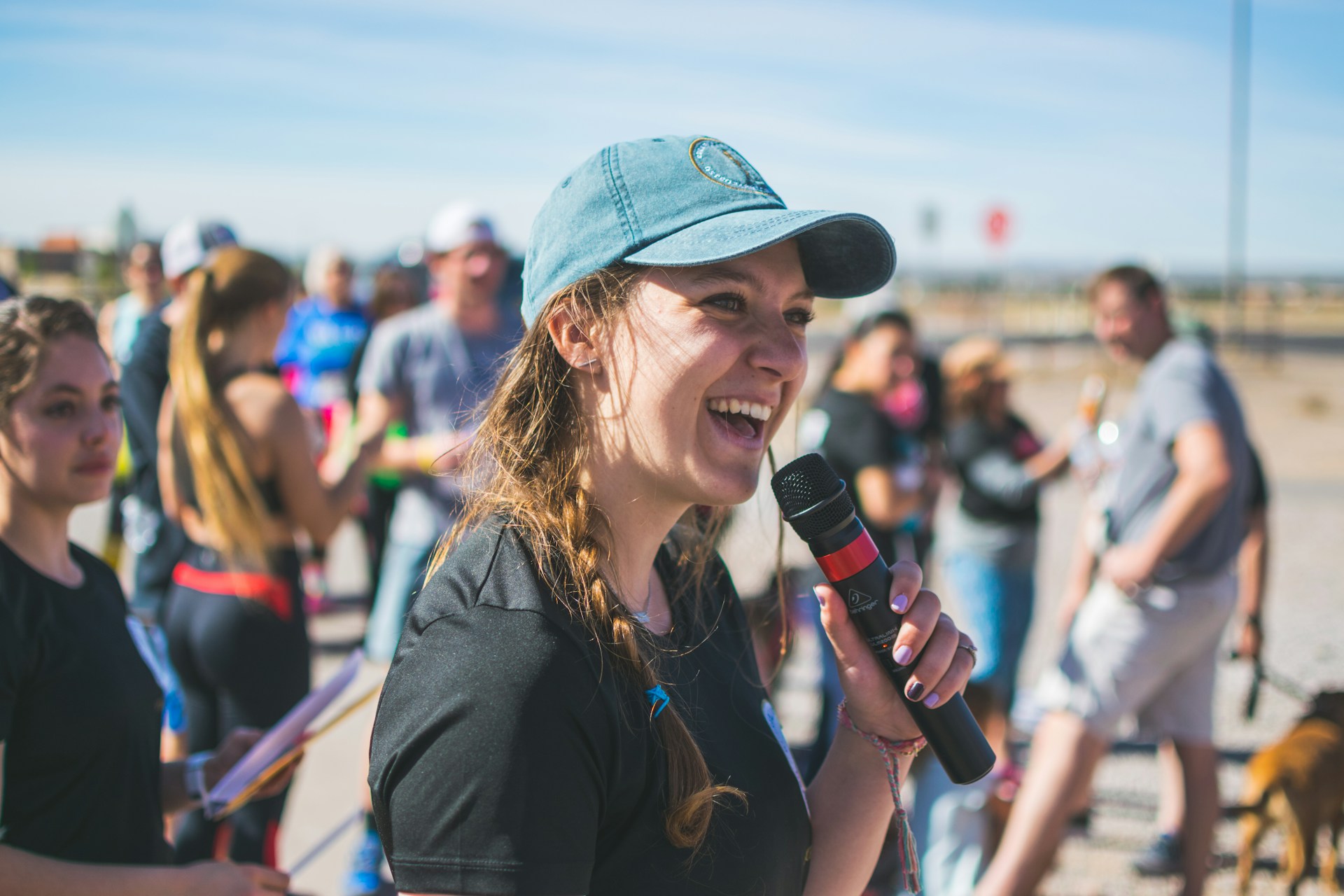 A dynamic shot of Natasha confidently addressing a networking event, engaging the audience with her clear, persuasive communication.