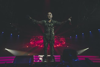 Prince Black Eagle mid-dance, vibrant stage lights casting dynamic shadows.