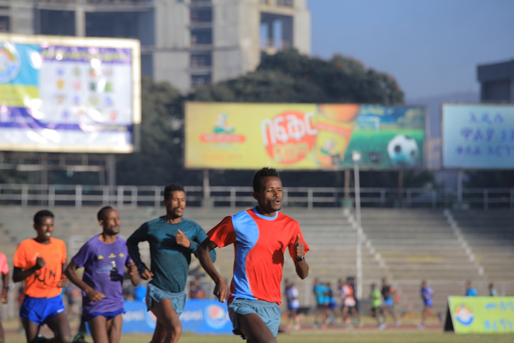 group of men running during daytime