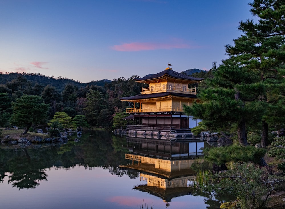 golden temple surrounded with body of water