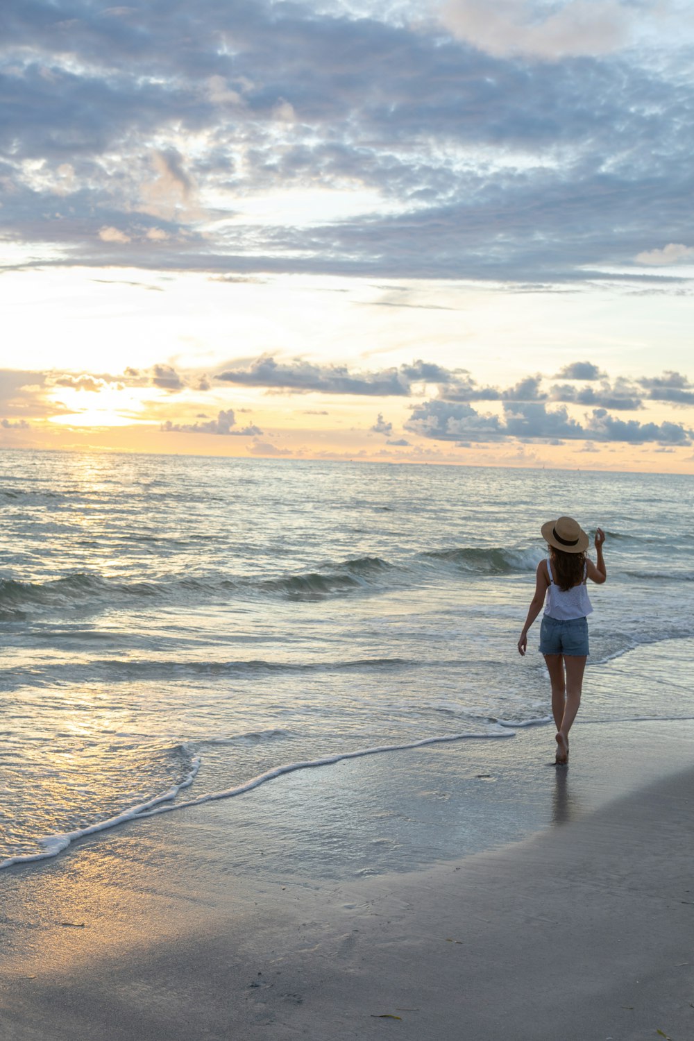 woman walking on seashore