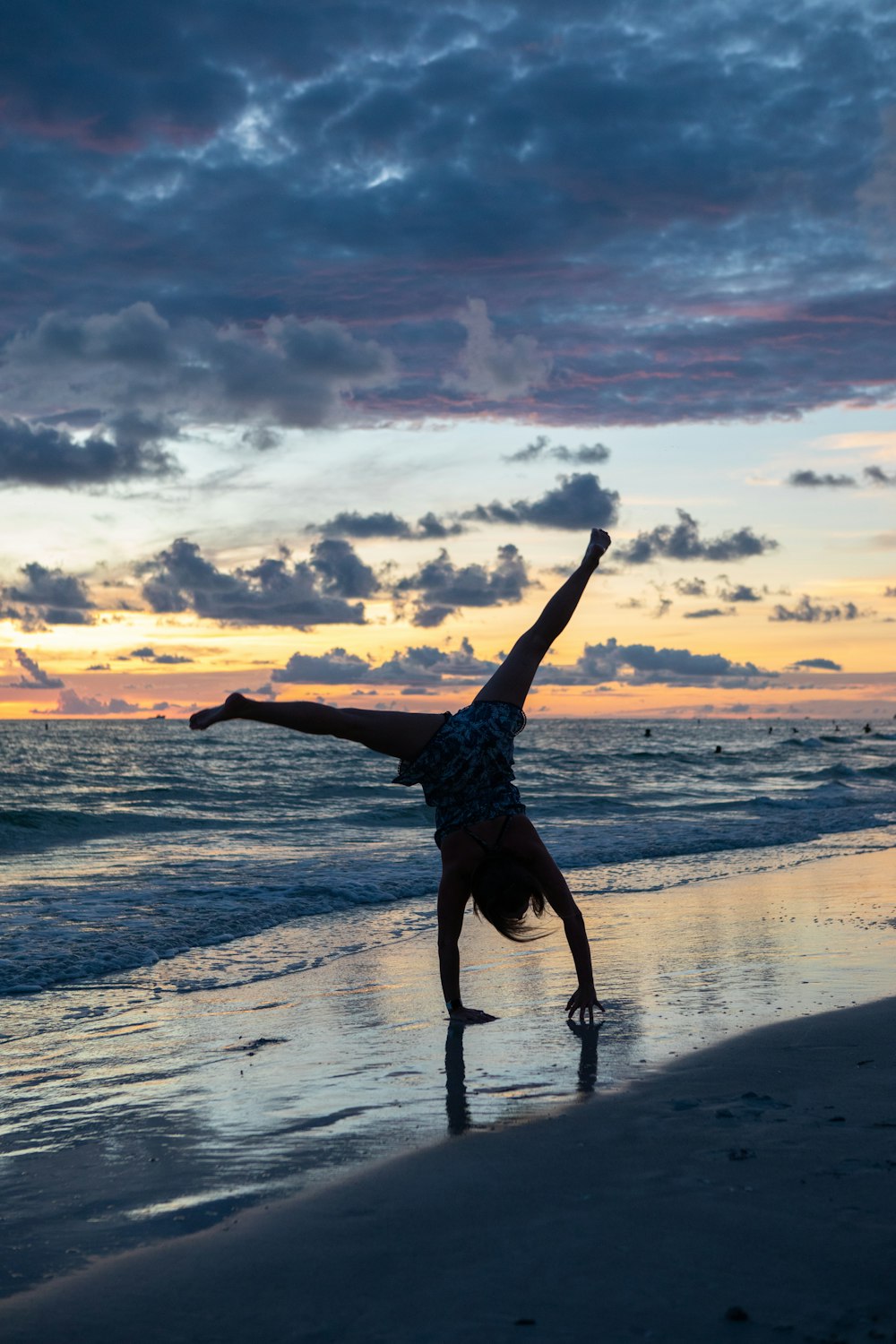 person standing upside down on seashore