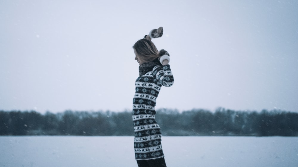 woman standing near body of water