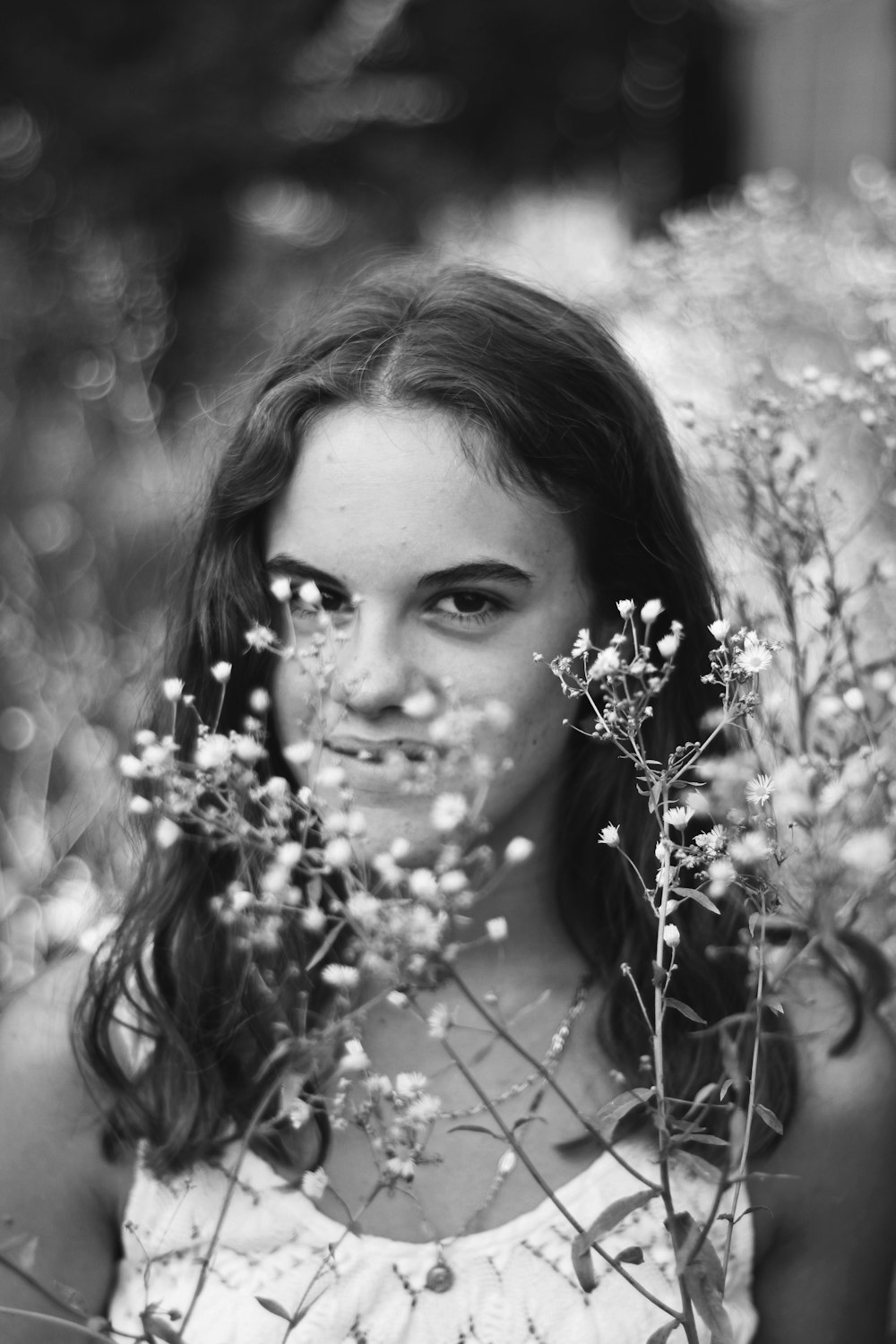 greyscale photo of smiling woman