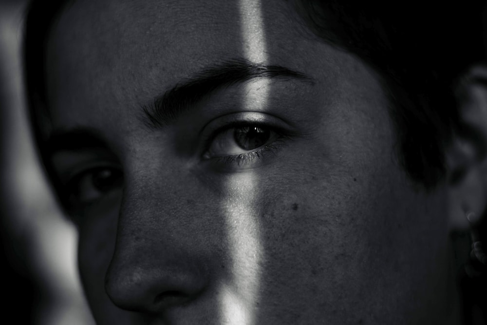 grayscale photography of person looking straight