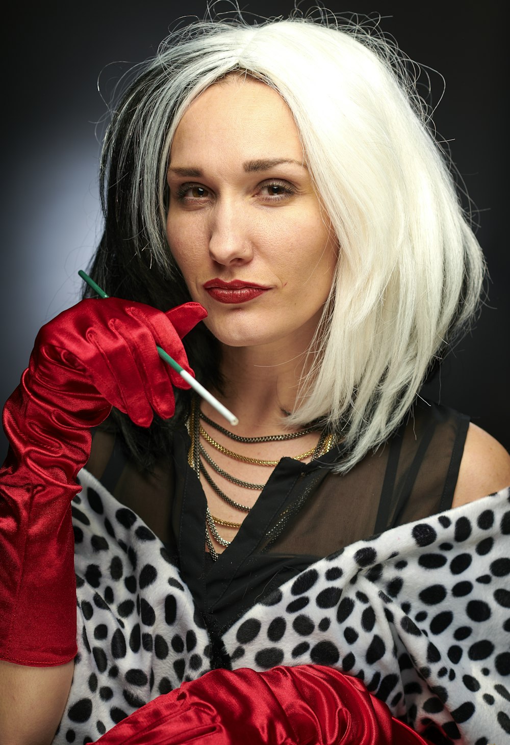 woman wearing Cruella de Vil costume