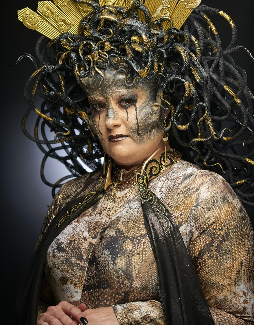 woman wearing black and grey Medusa costume