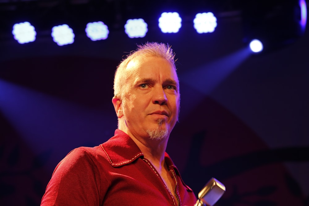 man wearing red collared shirt