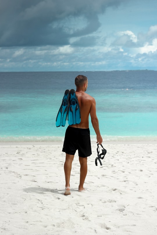 man at beach in Ukulhas Maldives