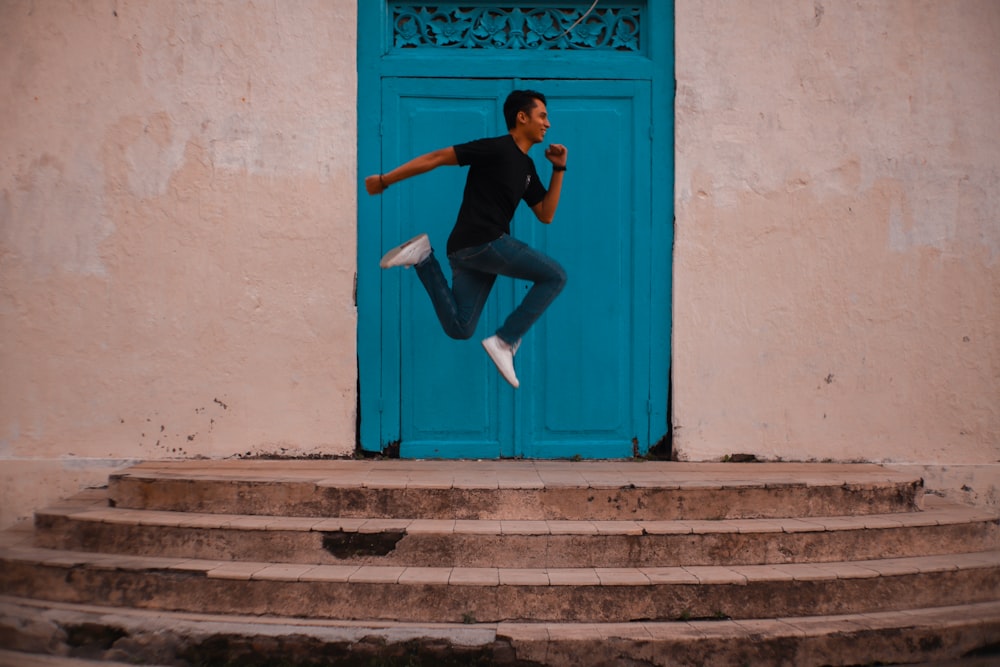 man jumping near door