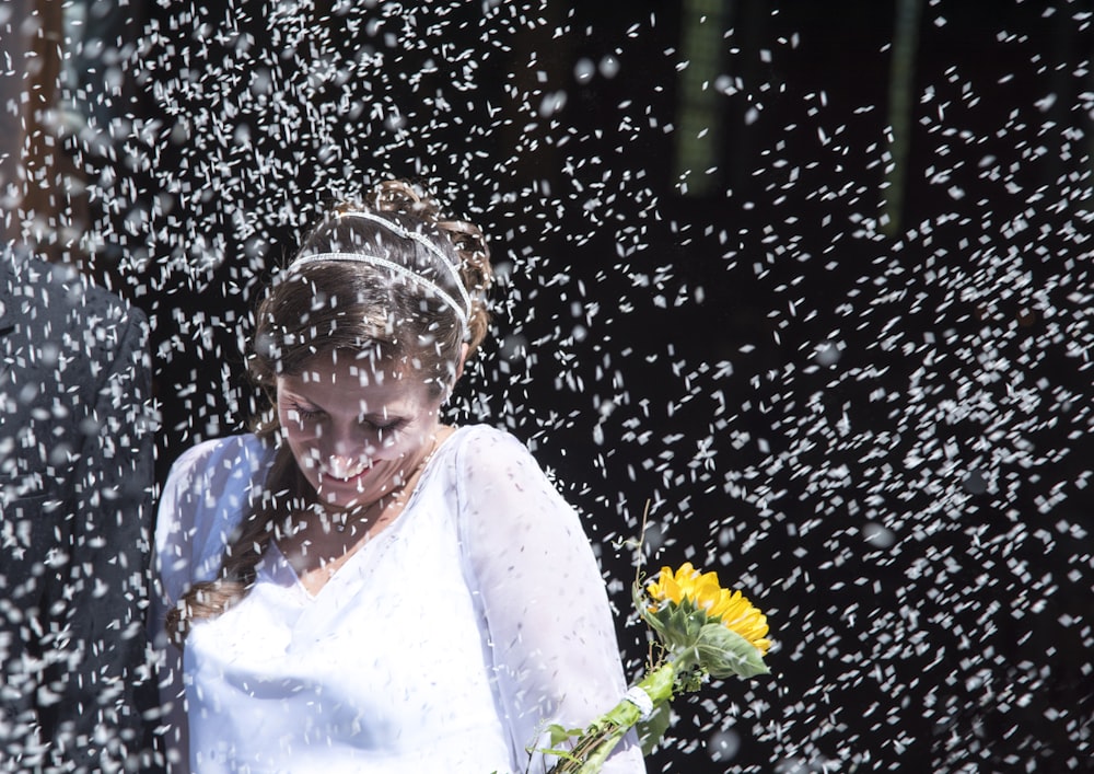 shallow focus photo of woman wearing yellow flower