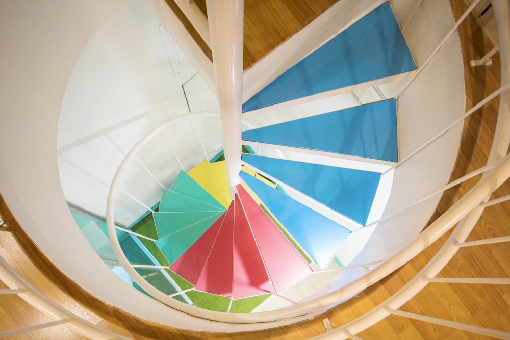 white and multicolored wooden spiral stairs