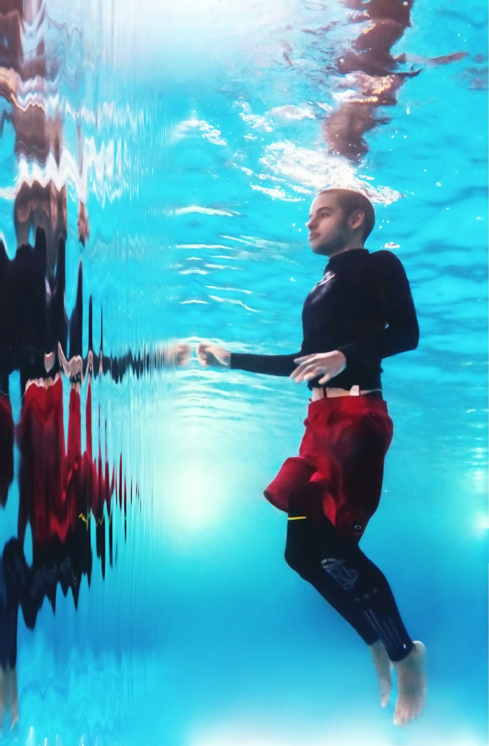 man swims at the pool