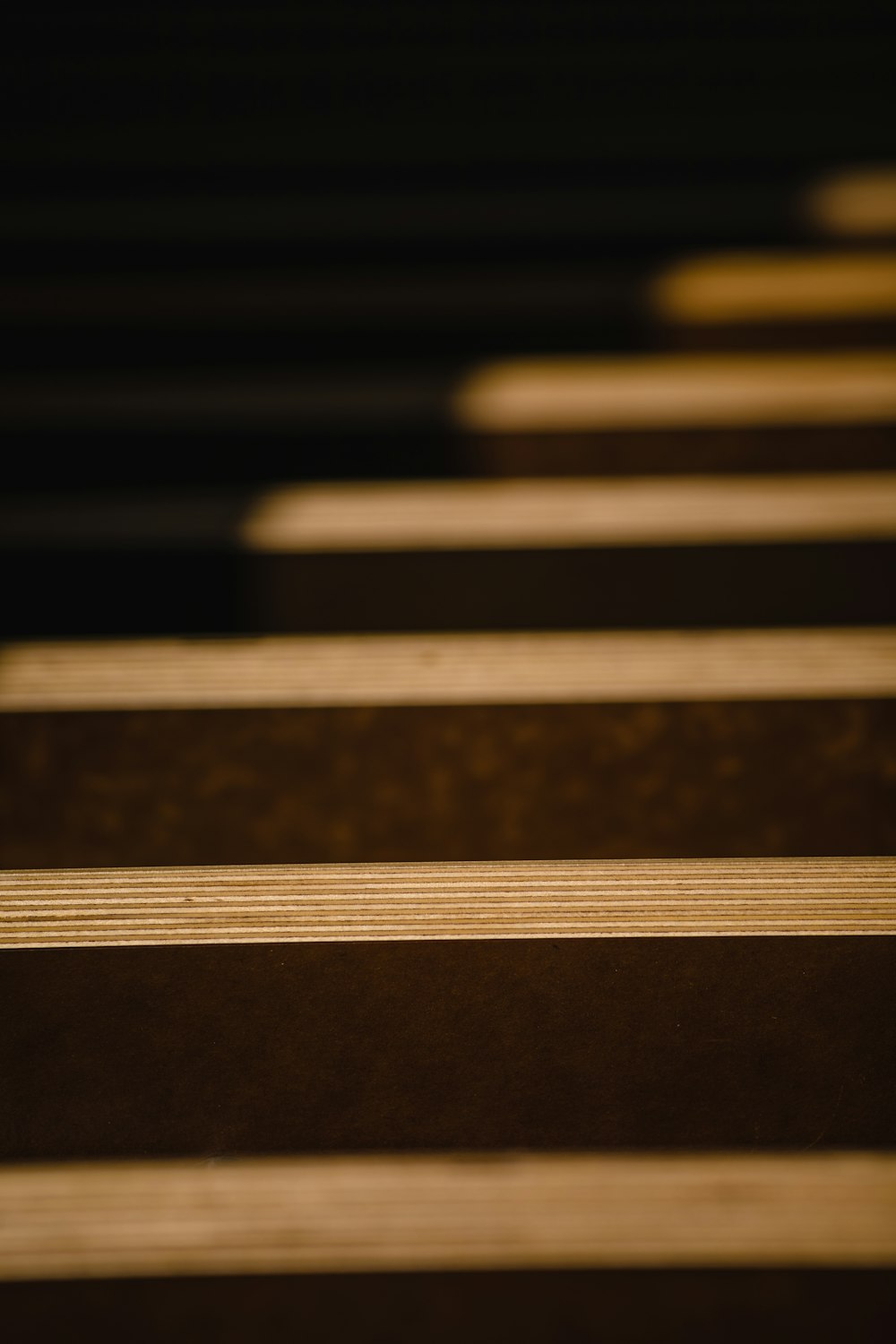 a close up of a row of wooden benches
