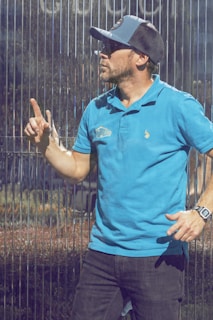 Casual street style shot of a man sporting a be xtraordinary polo shirt paired with jeans