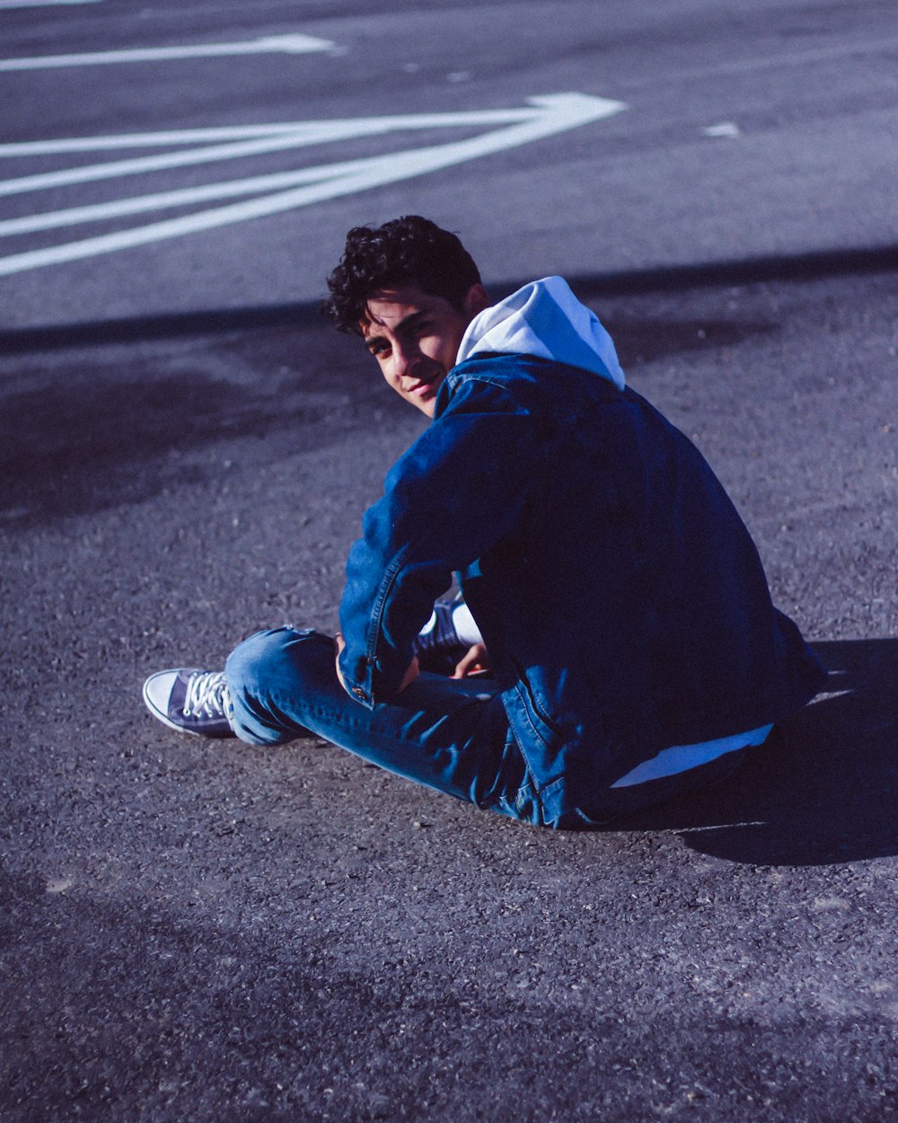 man sitting and looking over his left shoulder