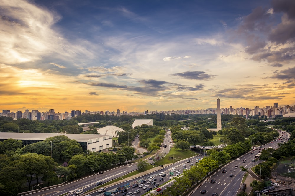 aerial photography of vehicles on road during golden hour