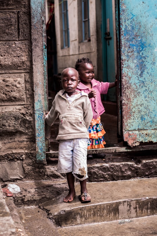 boy and girl near door in Korogocho Kenya