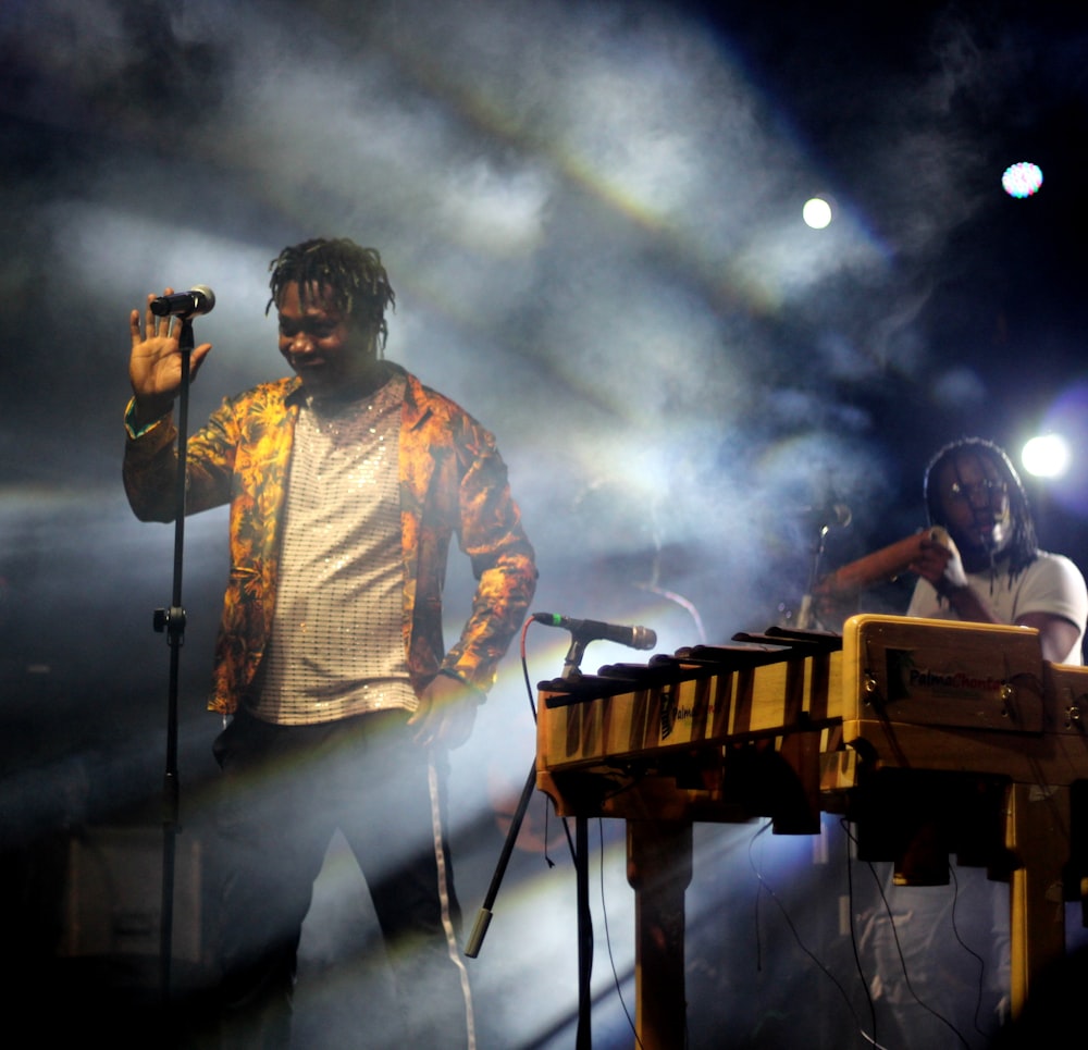 man singing on stage