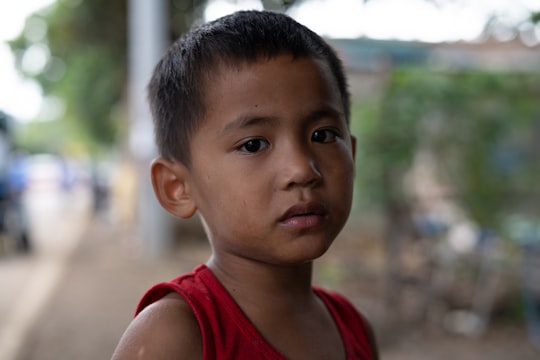 boy wearing red tank top in Cebu City Philippines