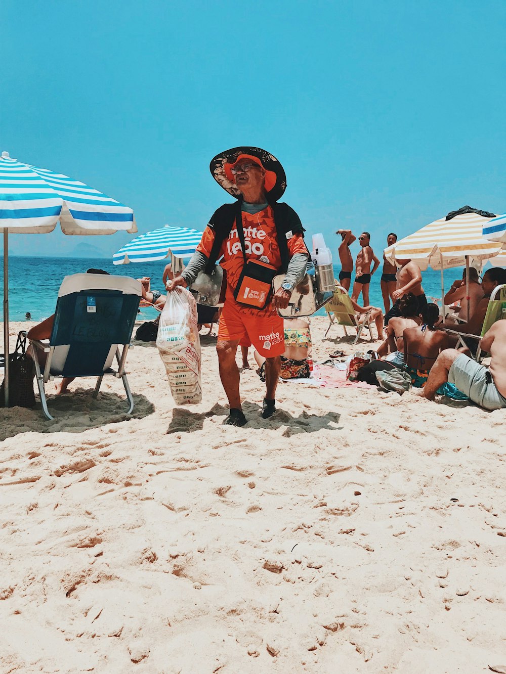 man selling in beach during daytime