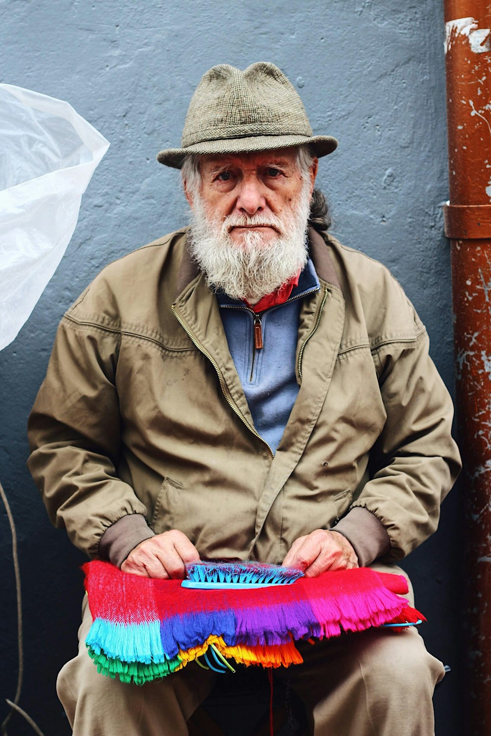 bearded man with decor on his lap