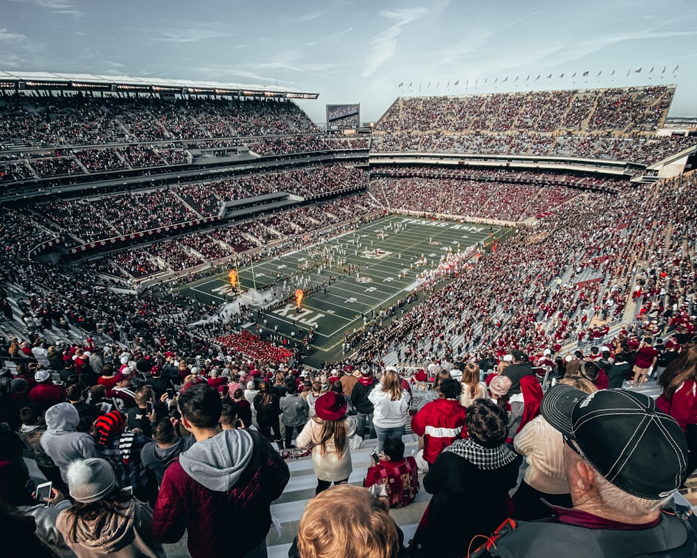 group of people watching football game