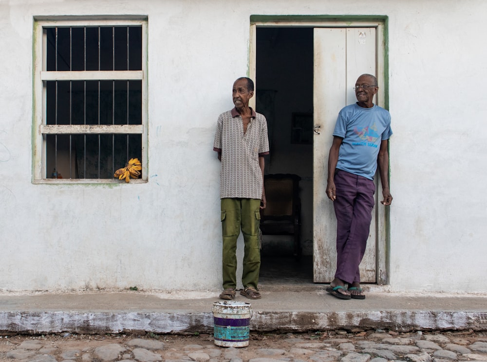 two men standing in front of door