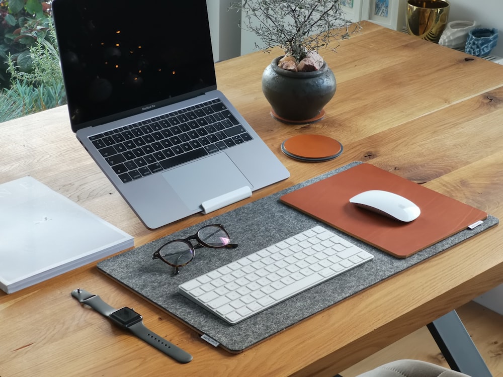 Shallow Focus Photo Of Gray Laptop Computer On Brown Wooden Table