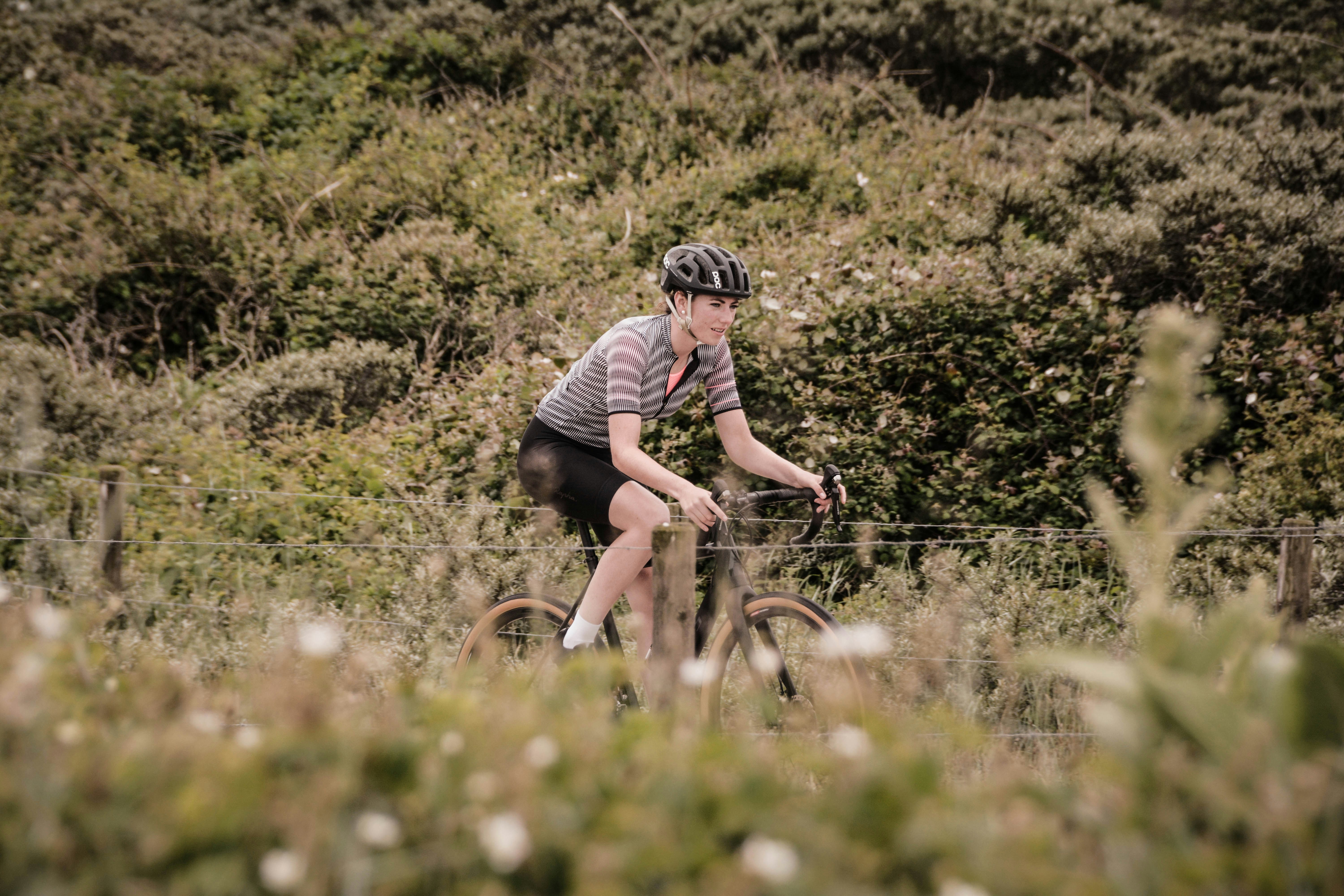 woman riding road bike during day
