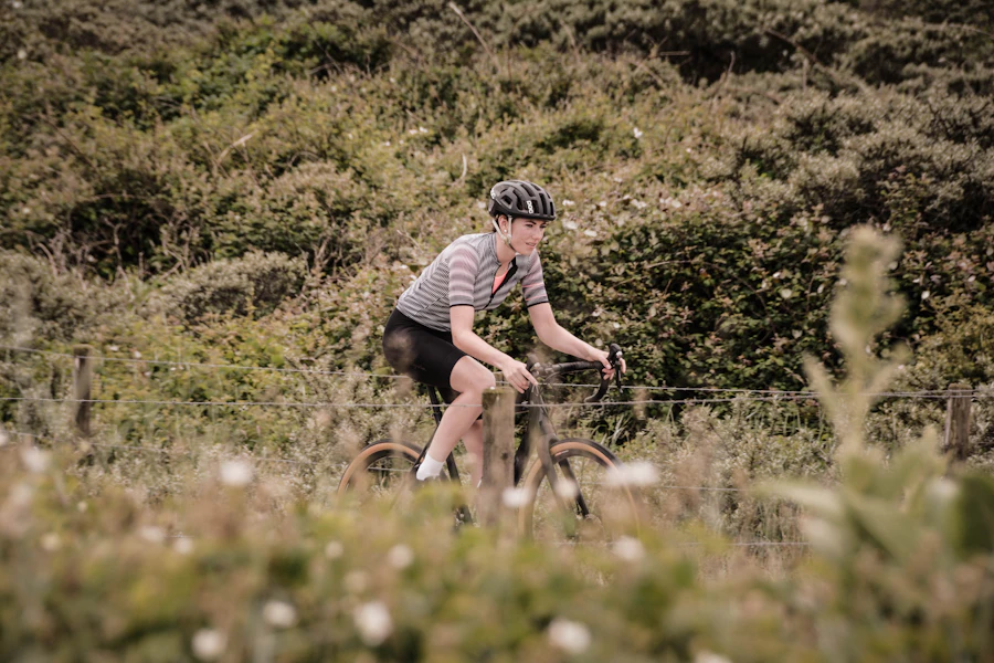 Woman cycling on a road bike during the day