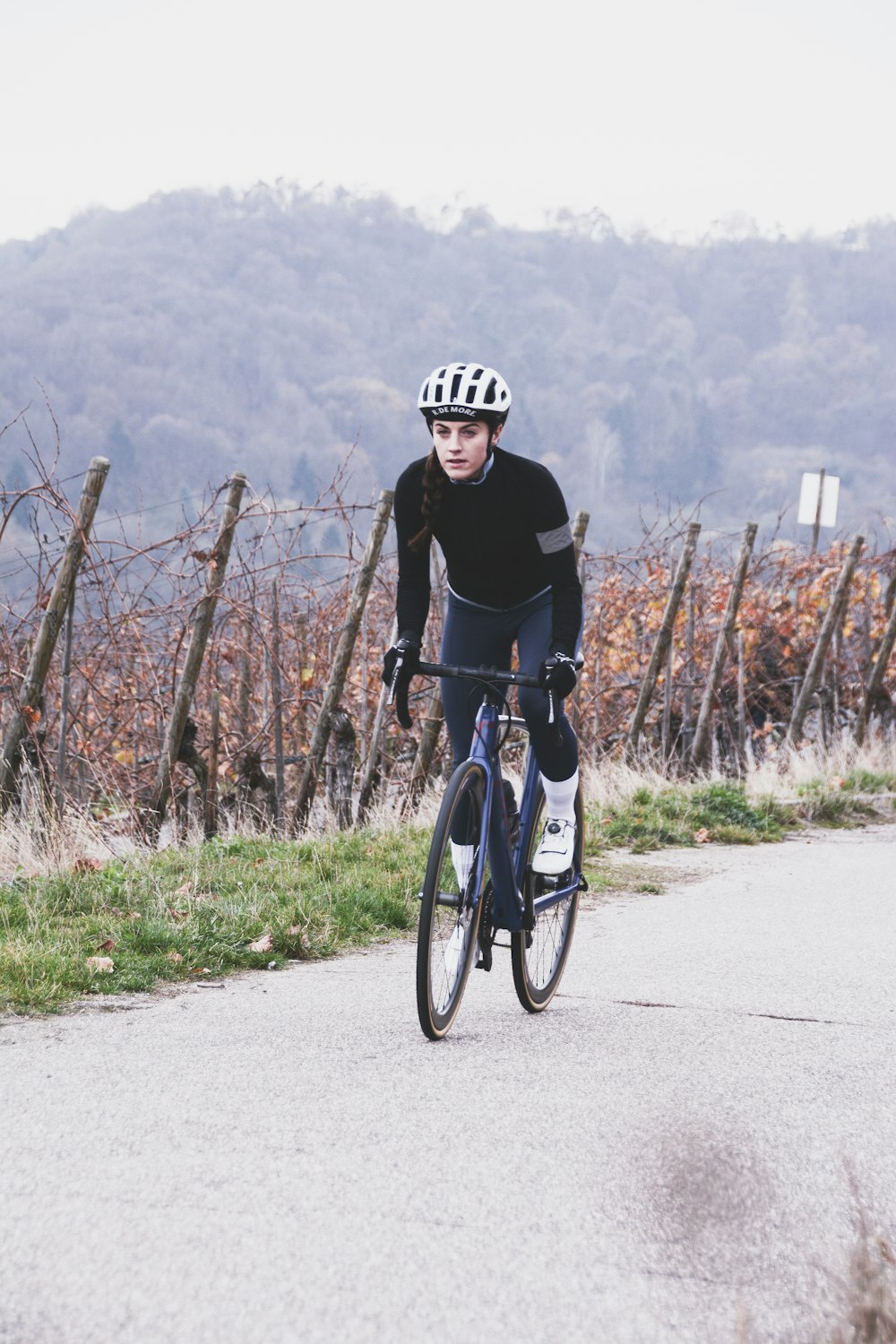 man riding road bike during day