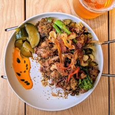 A vibrant plate of Peruvian food featuring pollo a la brasa.