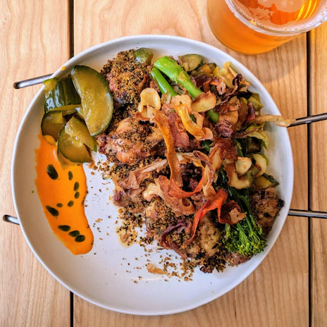 A vibrant plate of spicy Caribbean jerk chicken with colorful sides, capturing East Orange's rich flavors.