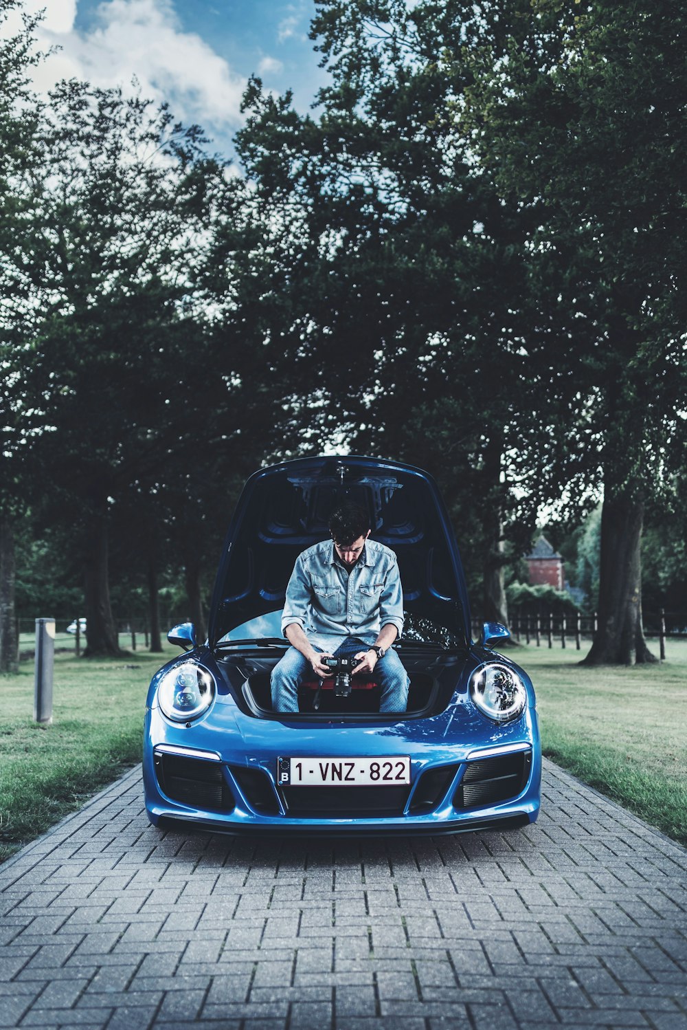 man sitting on vehicle