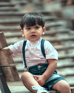 A relaxed moment of a child sitting comfortably on a bench, highlighting the set’s natural fit and softness.