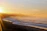 A serene Helensburgh beach at sunrise, symbolizing new beginnings.