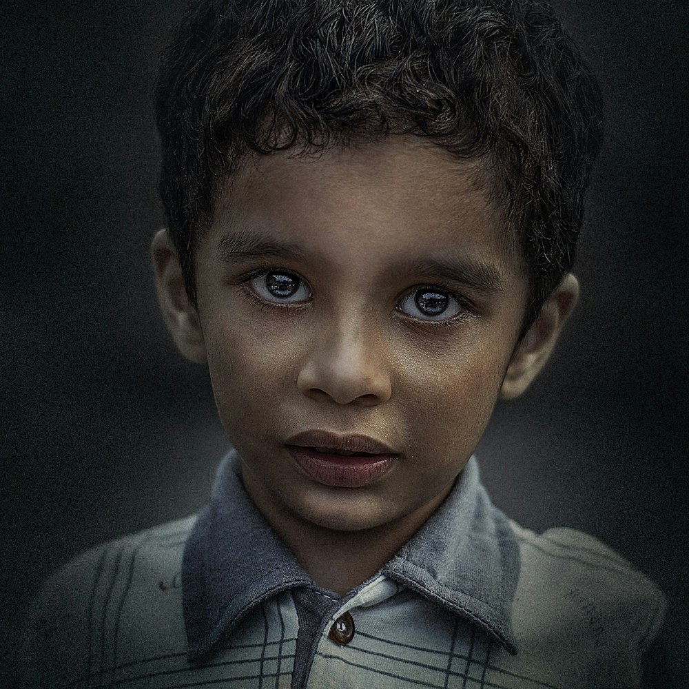 boy wearing white and gray collared top