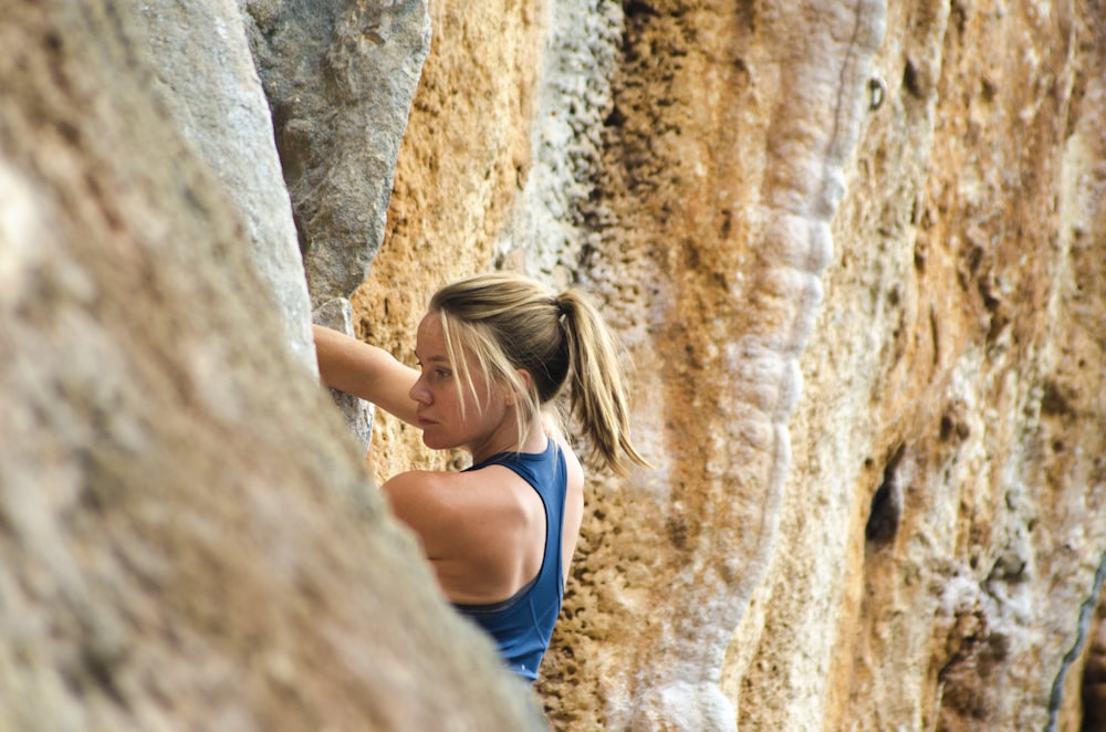 woman climbing mountain