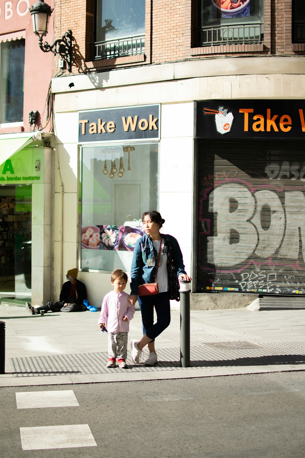 woman and toddler standing outdoors