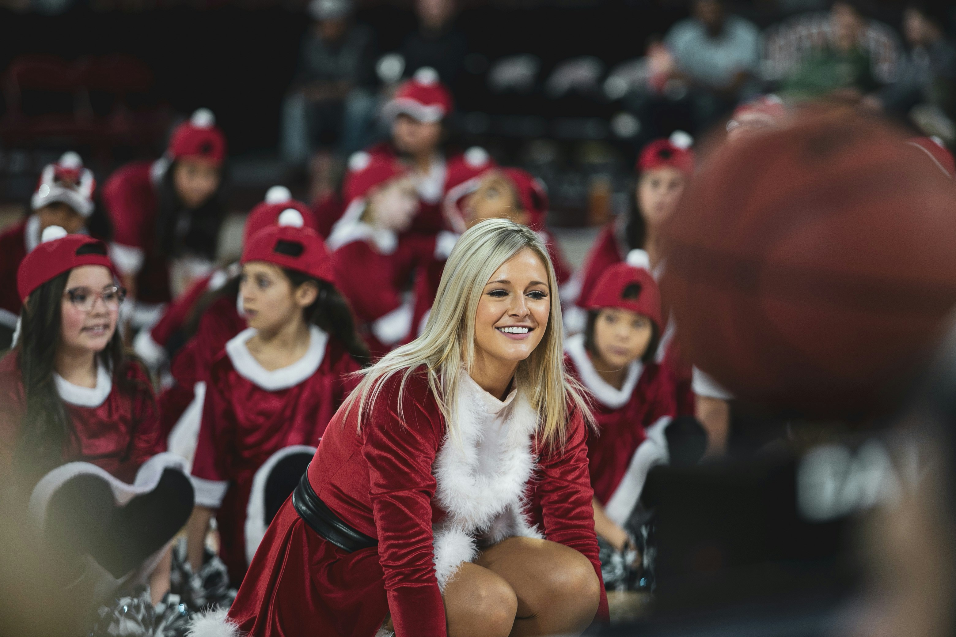 smiling woman in Santa Claus dress