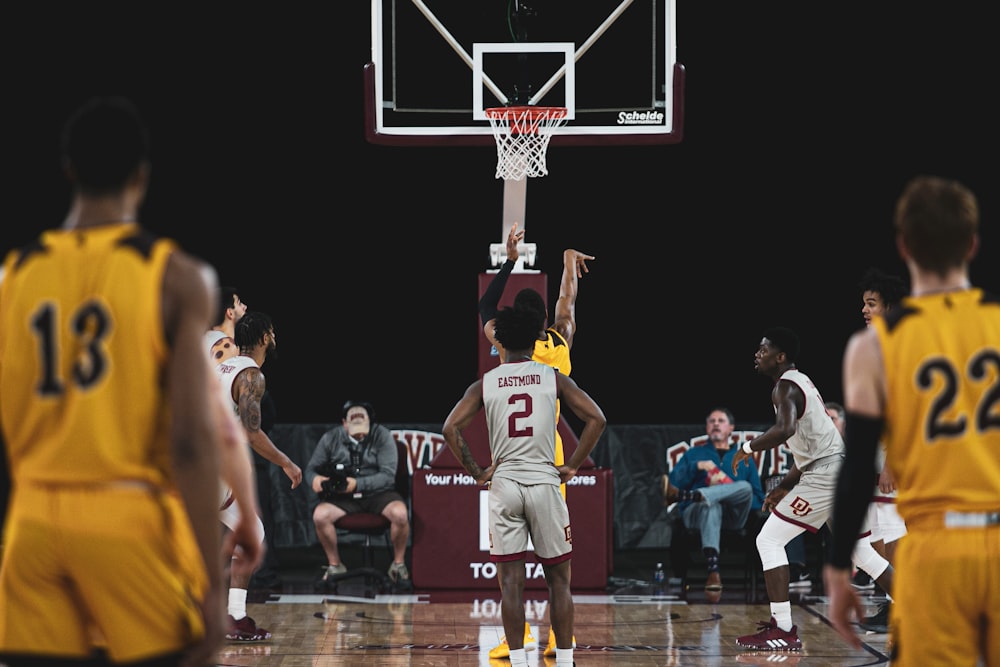 photography of men playing basketball