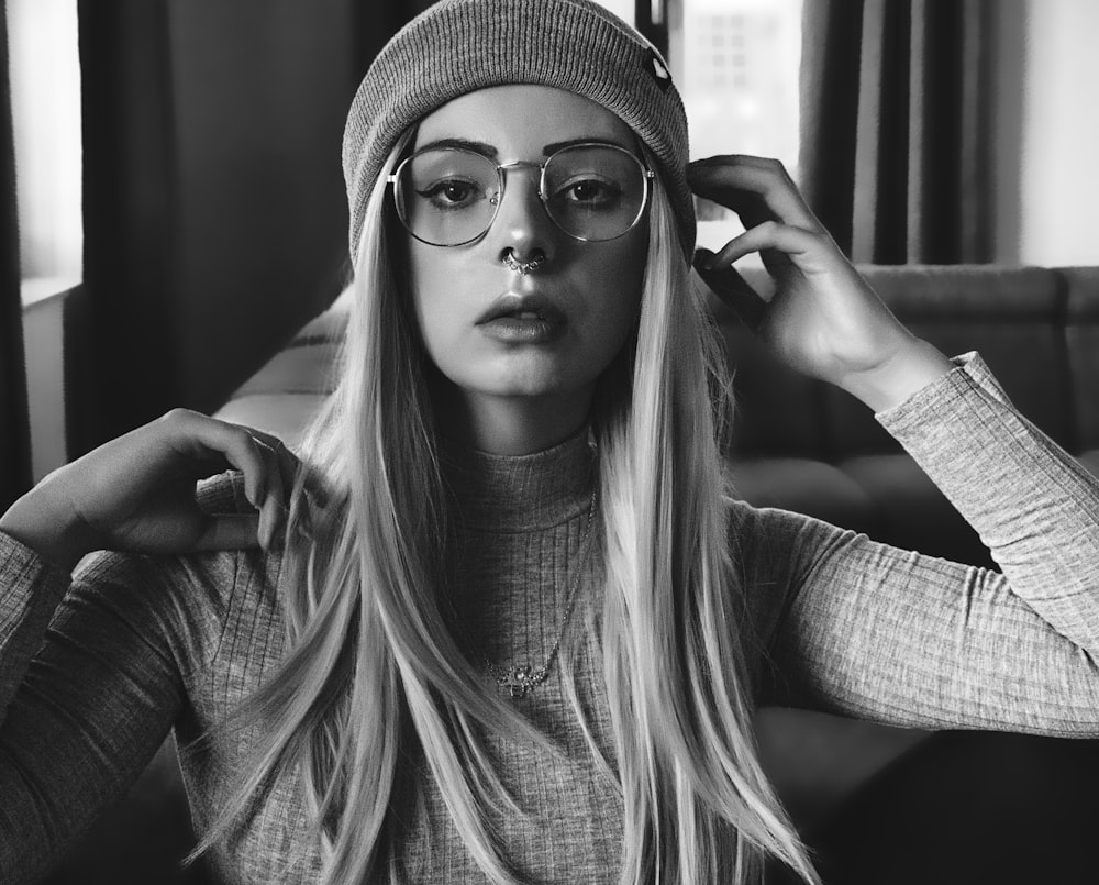 grayscale photography of woman wearing eyeglasses