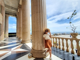 photography poses for women,how to photograph girl at the temple; woman leaning back on pillar during day