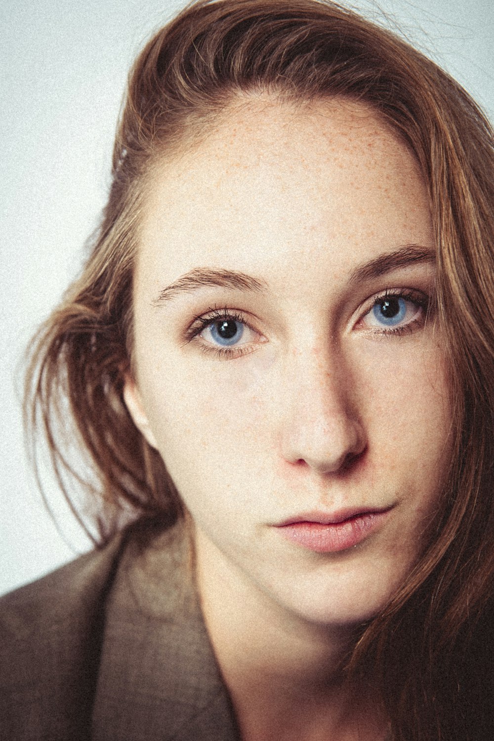 portrait photography of woman wearing gray top