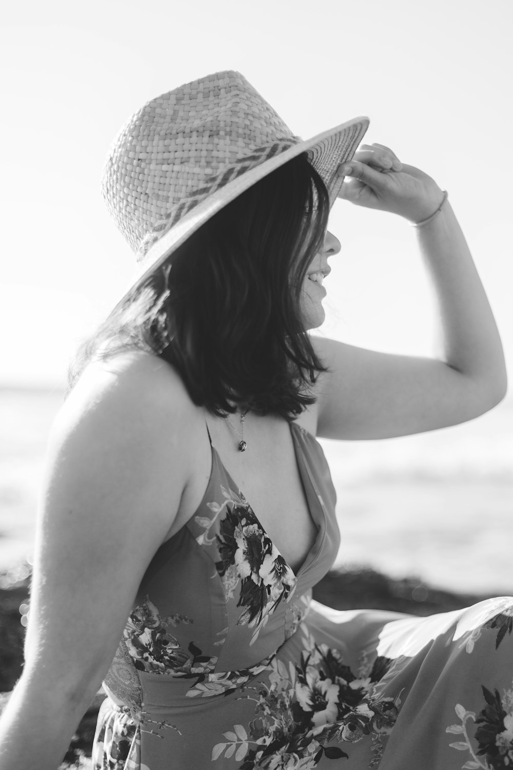 grayscale photography of woman wearing sun hat