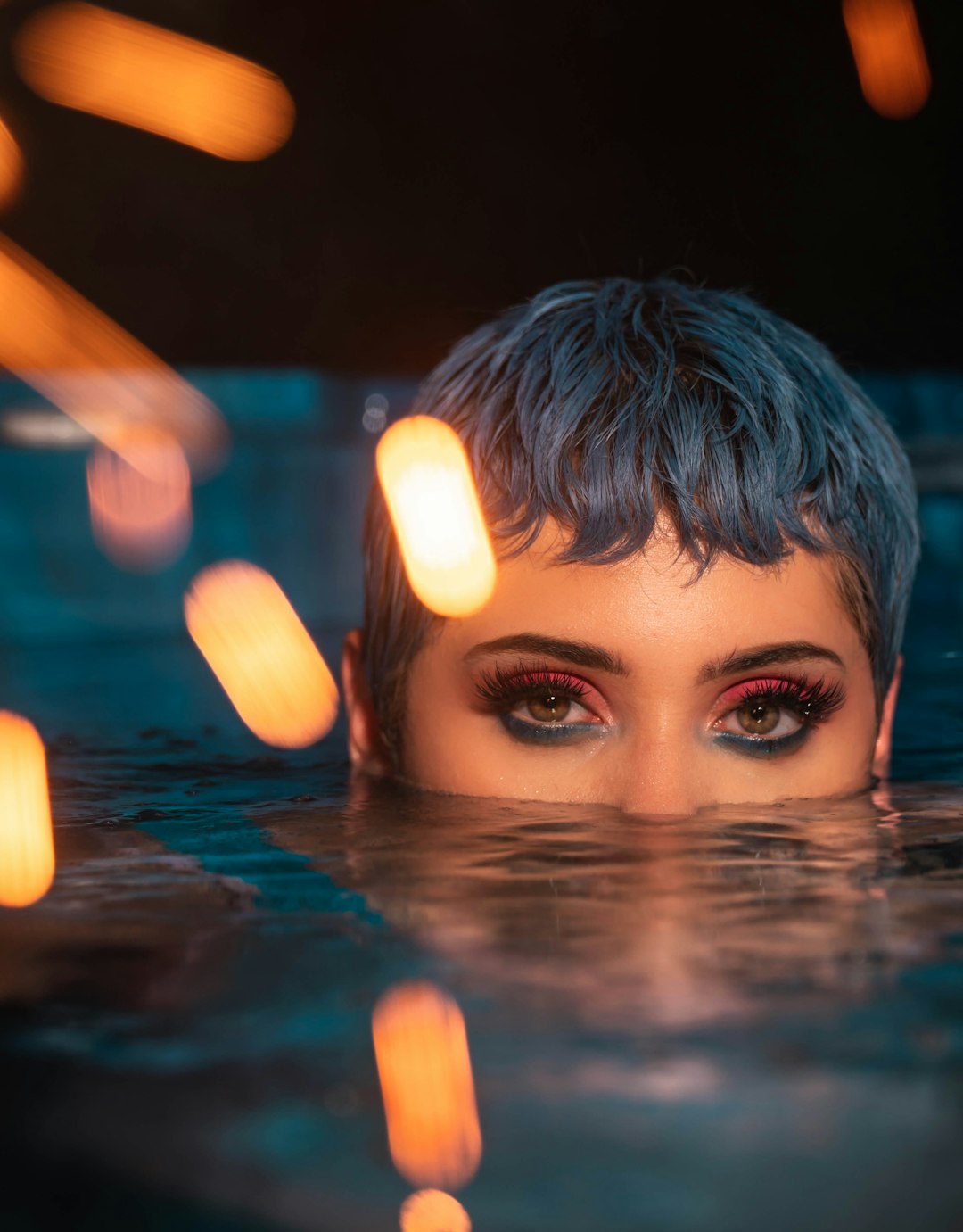 woman soaking her nose and mouth on water