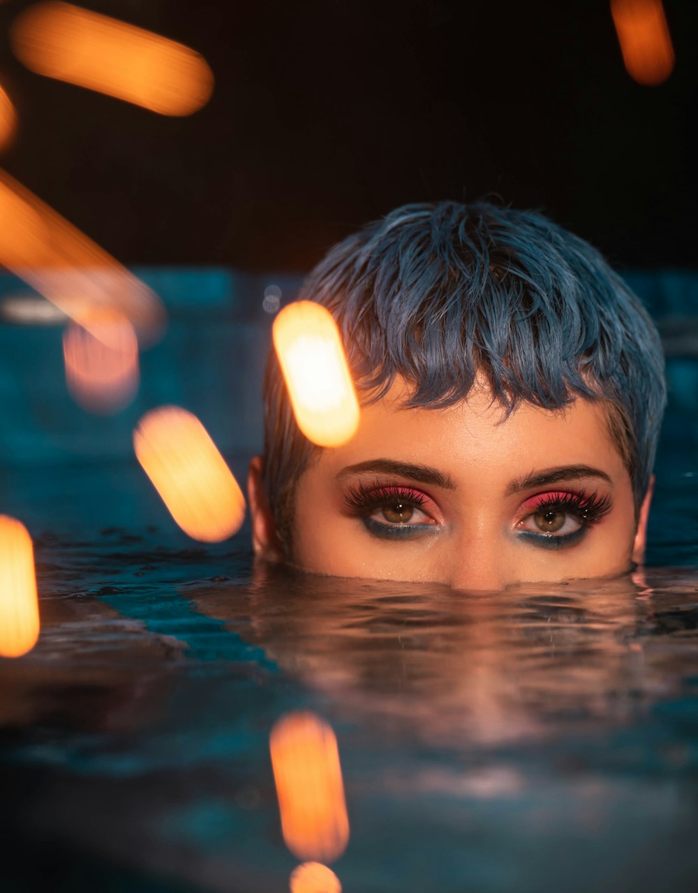 woman soaking her nose and mouth on water